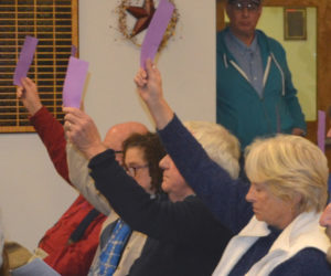 Damariscotta residents vote in favor of a bond issue during a special town meeting at the Damariscotta town office Wednesday, Nov. 16. (Maia Zewert photo)