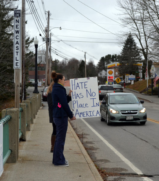 Rebekah Oliver, of Damariscotta, holds a sign that reads "hate has no place in America" on the Damariscotta-Newcastle bridge Saturday, Nov. 26. Oliver started the peaceful demonstrations after the election. (Maia Zewert photo)