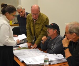 From left: Stepping Stone Housing Inc. Executive Director Marilee Harris presents the nonprofit's plan for a transitional housing development in Damariscotta to Town Planner Tony Dater and Damariscotta Planning Board members Stephen Cole, Jonathan Eaton, and Bruce Garren on Monday, Nov. 14. (Maia Zewert photo)