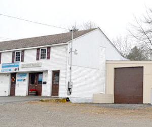 Stepping Stone Housing Inc. recently purchased a 1.8-acre property at 53 and 57 Biscay Road in Damariscotta. The property includes a commercial rental space, a six-bay garage, and a two-bedroom house (obscured). (Maia Zewert photo)