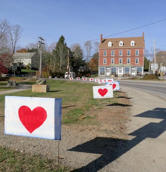 Campaign signs bearing hearts line Main Street in Newcastle next to Veterans Memorial Park the morning of Thursday, Nov. 10. (Photo courtesy Chris Johnson)