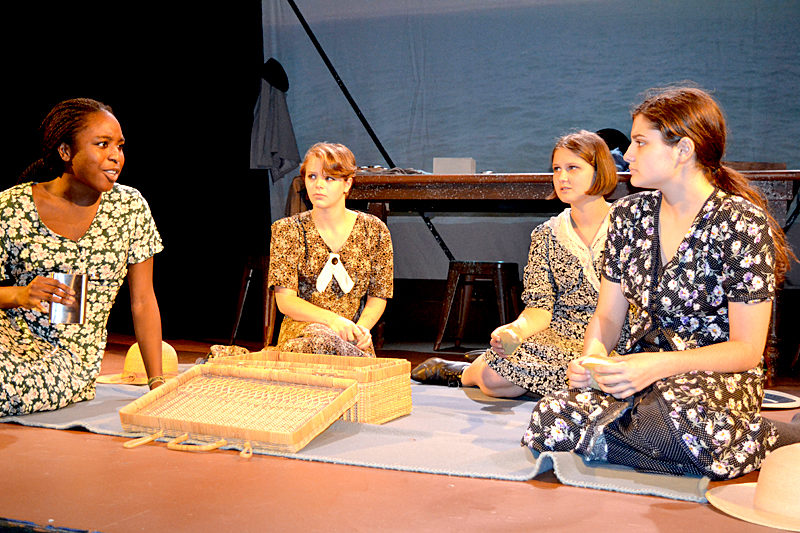 From left: Lincoln Academy students Toru Fiberesima, Rachael Schuster, Thalia Eddyblouin, and Noelle Timberlake play Pearl, Frances, Catherine, and Charlotte, respectively, in a dress rehearsal of the powerful Melanie Marnich play "These Shining Lives" at the Parker B. Poe Theater. (Christine LaPado-Breglia photo)