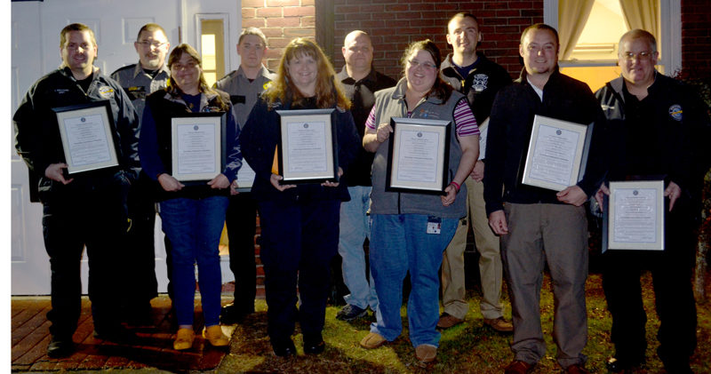 The participants in an emergency call that saved a Two Bridges Regional Jail inmate's life, back from left: Darryl Groh, Dylan Quimby, Kaleb Colbry, and James Pray. Front: Jacob Williams, Sonia Lilly, Wendy Williams, Emily Snowman, T.J. Merry, and Michael Williams. Not pictured: Dan Averill and Shaun Robinson. (Abigail Adams photo)