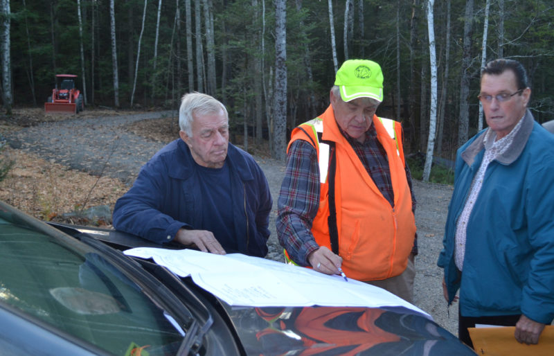 From left: Wiscasset Planning Board Chair Ray Soule, surveyor Karl Olson, and board member Lester Morse review an application for modifications to four lots in the Clark's Point Development subdivision plan during a site walk Thursday, Nov. 17. (Abigail Adams photo)