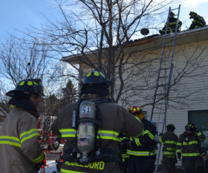 Firefighters from Jefferson, Nobleboro, Somerville, Waldoboro, and Whitefield responded to 252 East Pond Road after a chimney fire spread to the space between the flue liner and brick of the chimney on Sunday, Dec. 11. Crews worked on each floor of the house and the roof to extinguish the remaining heat, according to Jefferson Fire Chief Walter Morris. (Maia Zewert photo)