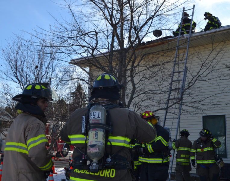 Firefighters from Jefferson, Nobleboro, Somerville, Waldoboro, and Whitefield responded to 252 East Pond Road after a chimney fire spread to the space between the flue liner and brick of the chimney on Sunday, Dec. 11. Crews worked on each floor of the house and the roof to extinguish the remaining heat, according to Jefferson Fire Chief Walter Morris. (Maia Zewert photo)