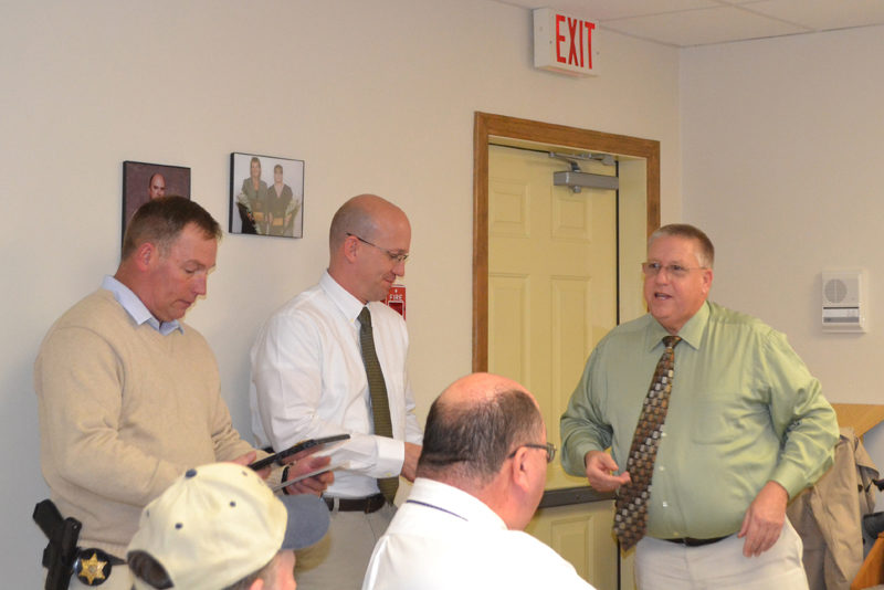 Lincoln County Sheriff Todd Brackett (right) recognizes outgoing Chief Deputy Ken Mason (left) and Sgt. Jason Nein for their service to the agency during a farewell party at the Lincoln County Communications Center in Wiscasset on Wednesday, Nov. 30. (Charlotte Boynton photo)