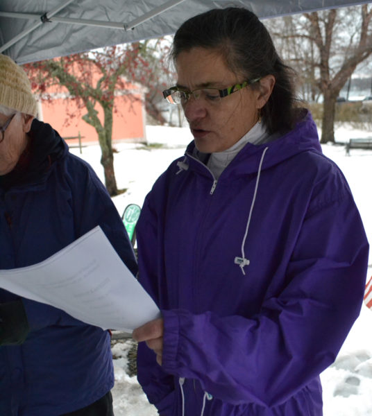 Damariscotta Baptist Church Pastor Marilee Harris reads a prayer for the homeless during a service at Veterans Memorial Park in Newcastle the afternoon of Sunday , Dec. 18. (Maia Zewert photo)