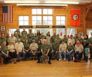 A group photo of the Vietnam War veterans who attended a week-long camp at Camp Kieve in Nobleboro Dec. 5-9, with guests and volunteers. (Photo courtesy Russ Williams)