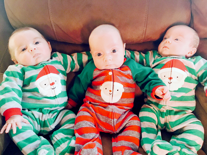 From left: South Bristol triplets Chloe, Camden, and Ainsley Merrill are ready for Christmas in their matching Santa Claus pajamas. Parents Amanda Sykes and Shane Merrill and big sister Avalee Brightman-Uhl welcomed the triplets Sept. 18. (Photo courtesy Amanda Sykes)