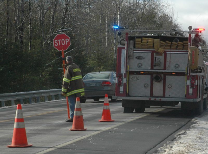 A member of the Somerville Fire Department conducts traffic control near the scene of a woods accident off of Route 17 on Friday, Dec. 9. (Alexander Violo photo)