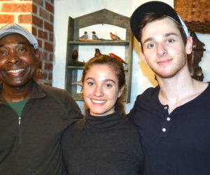 From left: Messan Jordan Benissan, Tristan Friedman, and Theo Satloff prepared a four-course meal of traditional Togolese cuisine for Wiscasset Area Chamber of Commerce members Thursday, Dec. 8. (Abigail Adams photo)