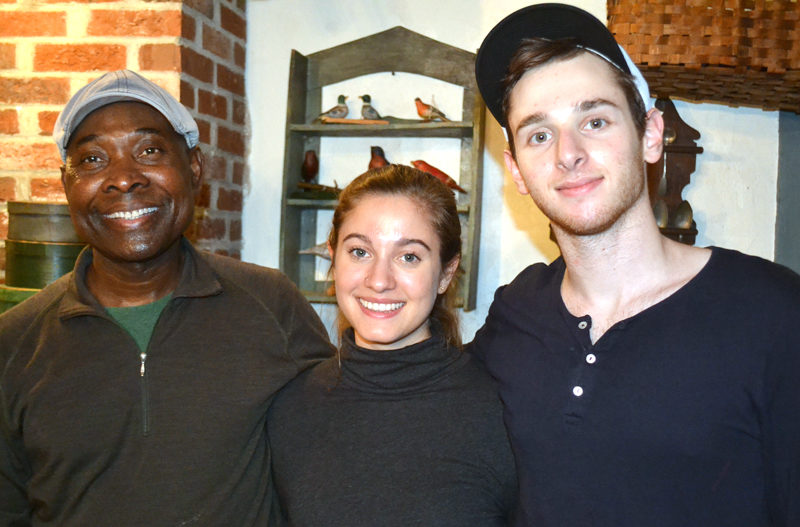 From left: Messan Jordan Benissan, Tristan Friedman, and Theo Satloff prepared a four-course meal of traditional Togolese cuisine for Wiscasset Area Chamber of Commerce members Thursday, Dec. 8. (Abigail Adams photo)