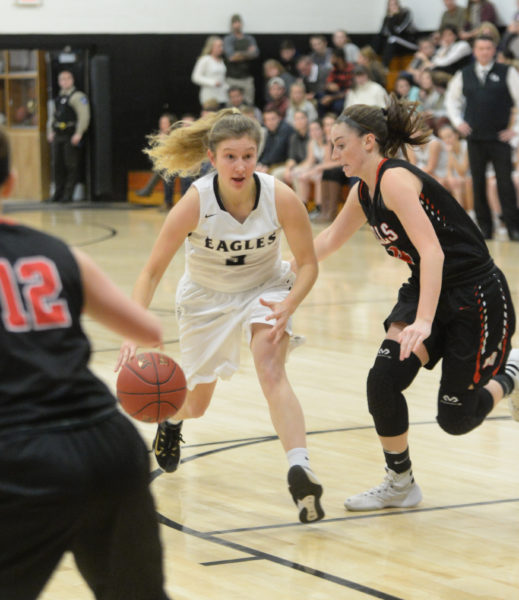 Brie Wajer looks for an open Eagle teammate as she drives inside. (Paula Roberts photo)