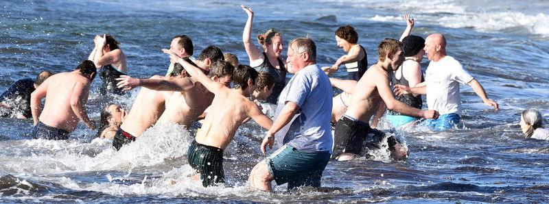 The Pemaquid Polar Bear Dip attracted its best turnout yet, thanks in part to the Lincoln County Football high school team. (Photo courtesy Sherrie Tucker)