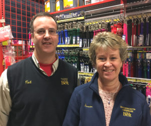 Rob Gardiner and Susan Geyer in the pet section at Damariscotta Hardware. The store will give a $20 gift card to everyone who adopts one of the shelter animals on the sponsorship page in this edition.