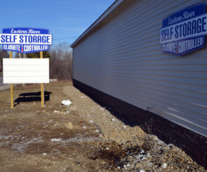 A woman was charged with operating under the influence after the vehicle she was driving struck the Eastern River Self Storage building the evening of Sunday, Jan. 15. (Maia Zewert photo)