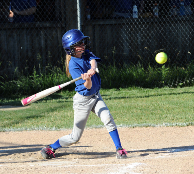 Alice Skiff takes a swing during a softball game. Alice, a seventh-grader at Great Salt Bay Community School, said she enjoys playing softball, cheerleading, and dancing. (Paula Roberts photo, LCN file)