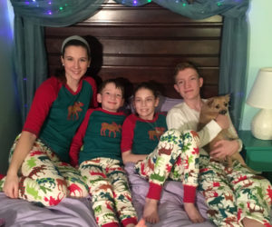 After almost two months at the Barbara Bush Children's Hospital in Portland after surgery to remove a brain tumor, 12-year-old Alice Skiff was discharged to spend Christmas with her family at their Newcastle home. From left: Margaret, William, Alice, and Gardner Skiff. (Photo courtesy Linda Skiff)