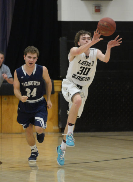Riley Cushing passes the ball up the court in the Eagles loss to Yarmouth Friday night. (Paula Roberts photo)