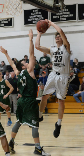 Cody Tozier powers to the hoop for Lincoln Academy. (Paula Roberts photo)