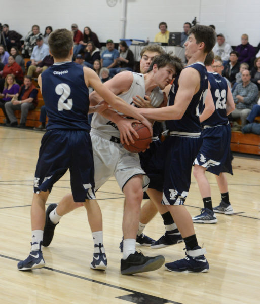 Cody Tozier is swarmed by three Yarmouth players. (Paula Roberts photo)