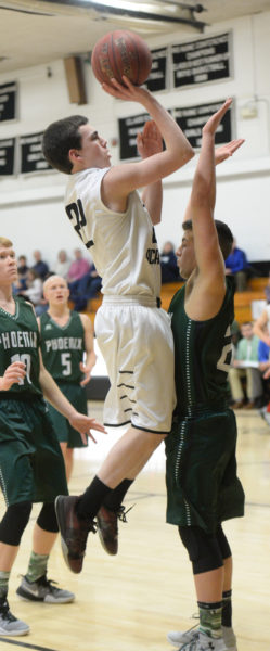 Bryce York shoots over a Spruce Mountain defender. (Paula Roberts photo)