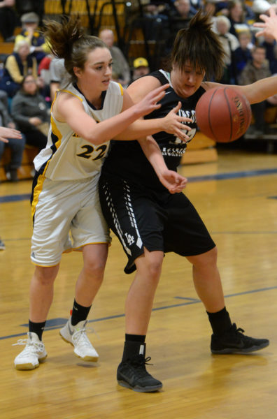 Sadie Cohen and Brianna Genthner battle for a rebound in the Lady Eagles win at Medomak. (Paula Roberts photo)