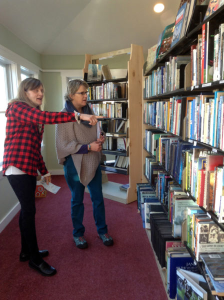 Skidompha Secondhand Book Shop volunteers Margaret Gregory (left) and Margot Stiassni-Sieracki discuss labels for the bookshelves at the shops new location, 17 Backstreet Landing, Damariscotta. The new shop will open at 9 a.m. on Wednesday, Feb. 1.