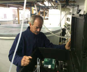 Bill Mook checks "black box" tool. (Photo courtesy Bill Mook)