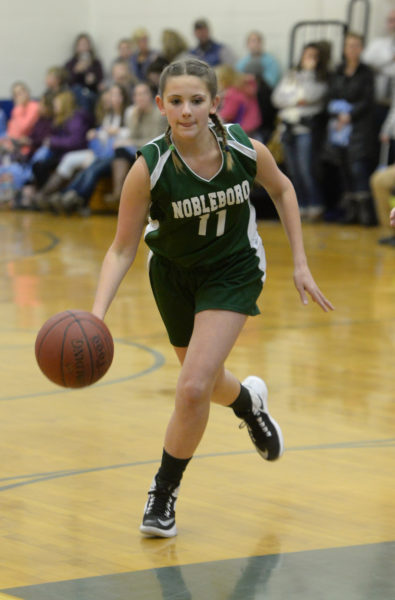 Hayley Phillips brings the ball up court for the Lady Lions. (Paula Roberts photo)