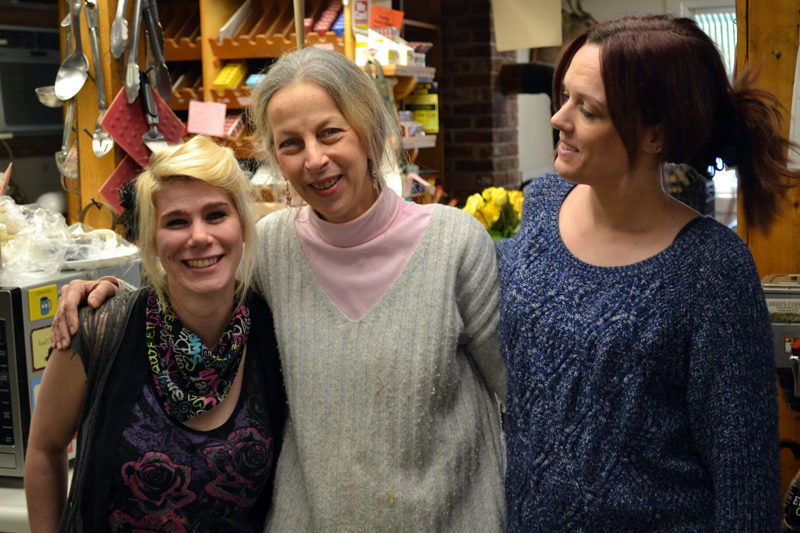 Amy Preston (center) with longtime Alna Store staff members Darci Day (left) and Allison Bailey on Monday, Feb. 27, the day before the store's sale to Ken and Jane Solorzano. (Abigail Adams photo)