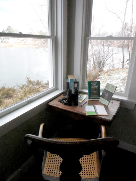 The birdwatcher's nook at the new location of Skidompha Secondhand Book Shop overlooks the Damariscotta River and features bird books, a pair of binoculars, and a nature journal. (Christine LaPado-Breglia photo)