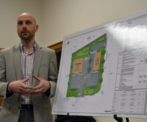 Austin Turner, a civil engineer with Bohler Engineering, discusses Damariscotta DG LLC's application to develop the 1.8-acre property at the intersection of Main Street and Biscay Road during a meeting of the Damariscotta Planning Board on Monday, Feb. 6. The application calls for the construction of a Dollar General and a Sherwin-Williams store. (Maia Zewert photo)