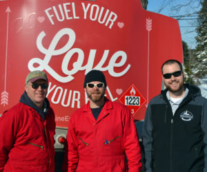 From left: Colby & Gale Inc. drivers Ralph Eugley and Tim Pratt and manager Matt Poole with a specially decorated oil truck on Valentine's Day. Colby & Gale was participating in a statewide event called Fuel Your Love. (Maia Zewert photo)