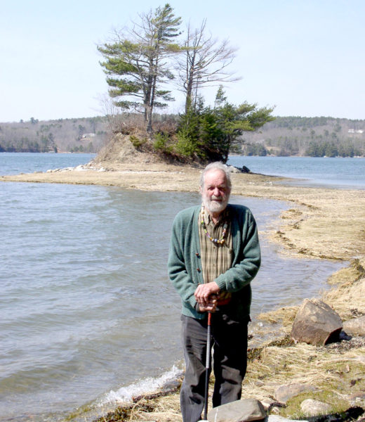 Huston Dodge stands in front of the Damariscotta River on the property he donated to the Damariscotta River Association in 2006. (Photo courtesy Damariscotta River Association)