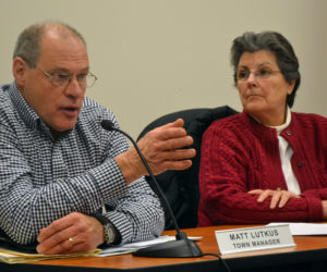 Damariscotta Town Manager Matt Lutkus speaks about the Bristol Road sidewalk project as Damariscotta Board of Selectmen Chair Robin Mayer looks on during a public hearing Wednesday, Feb. 15. (Maia Zewert photo)