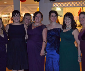 From left: Lincoln County Spark members Sam Mehlhorn, Cerina Leeman, Taylor Corson, Bronwen Hanna, Annie Avantaggio, Brynne Hanna, and Terri Herald attend the organization's fifth annual Snowball at Water's Edge in Edgecomb on Saturday, Feb. 25. (Abigail Adams photo)