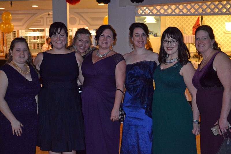 From left: Lincoln County Spark members Sam Mehlhorn, Cerina Leeman, Taylor Corson, Bronwen Hanna, Annie Avantaggio, Brynne Hanna, and Terri Herald attend the organization's fifth annual Snowball at Water's Edge in Edgecomb on Saturday, Feb. 25. (Abigail Adams photo)