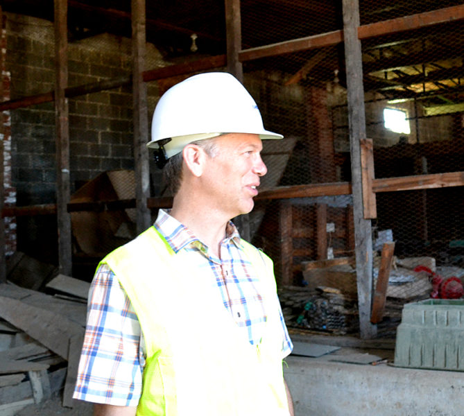Stephen Dyer, of Ransom Consulting Inc., stands inside the former Mason Station plant's maintenance building during an environmental assessment in May 2016. The Wiscasset Board of Selectmen accepted Peregrine Turbine Technologies' offer to purchase the maintenance building Monday, Jan. 30.  (Abigail Adams photo, LCN file)