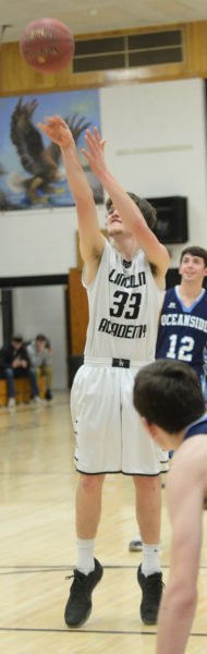 Lincoln Academy sernior Cody Tozier scored his 1,000th career point at the foul on Feb. 2 against Oceanside. (Paula Roberts photo)