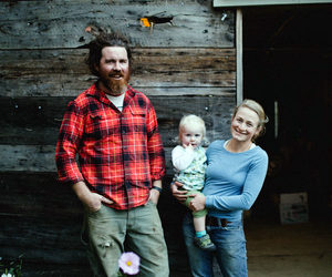 Brady Hatch and her husband Brendan McQuillen (pictured here with their child) are the owners of Morning Dew Farm. (Photo courtesy Erin Little Photography)