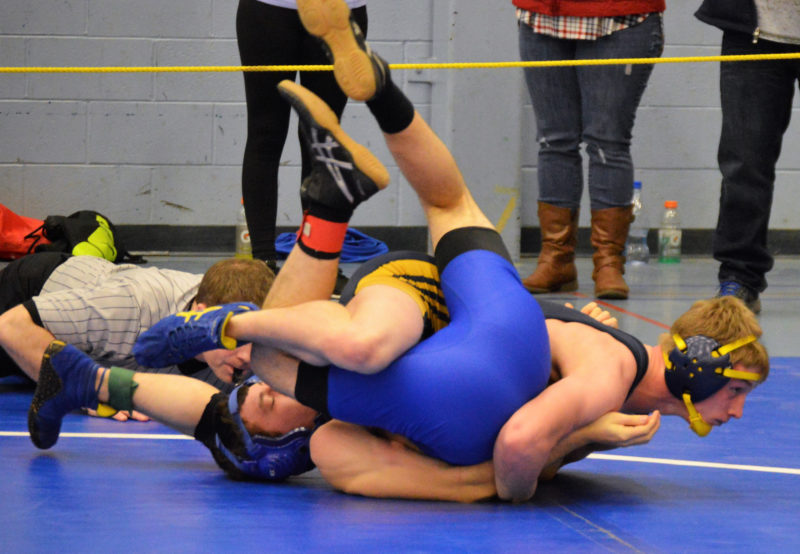 Medomak Valley senior Steven Thompson wraps up Erskine's William Bourque. Thompson won the 138 pound KVAC title and was named wrestler of the meet.  (Carrire Reynolds photo)