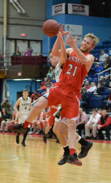 Kevin Lynch leaps into the air to catch a full court pass from a Wiscasset teammate. (Carrie Reynolds photo)