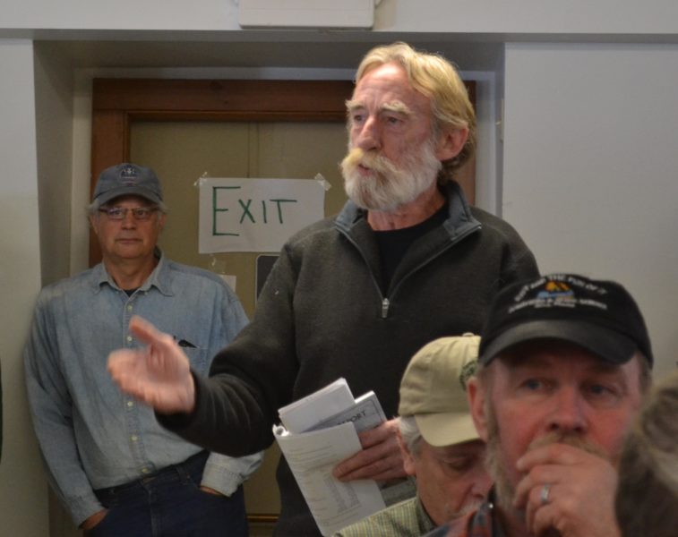 Head Tide Dam Committee member Ralph Hilton speaks in favor of entering into a contract with the Atlantic Salmon Federation to modify the dam at Alna's annual town meeting on Saturday, March 18. (Abigail Adams photo)