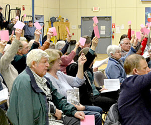 Bristol residents vote on the education budget during the annual town meeting at Bristol Consolidated School on Tuesday, March 21. (Maia Zewert photo)