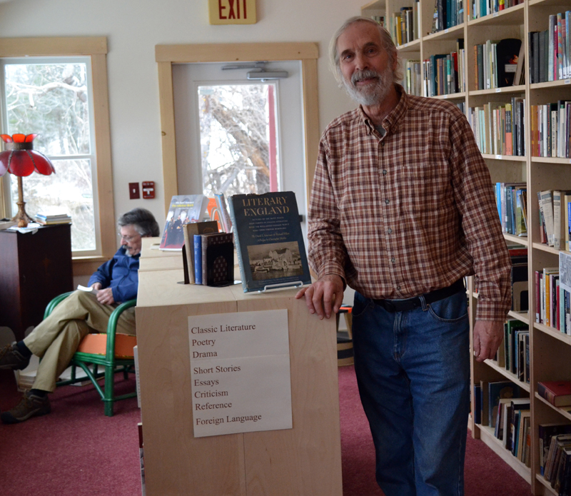 Skidompha Second Hand Bookshop co-manager Rem Briggs in the literature section of the shop's new home at 17 Backstreet Landing on Saturday, March 25. (Abigail Adams photo)