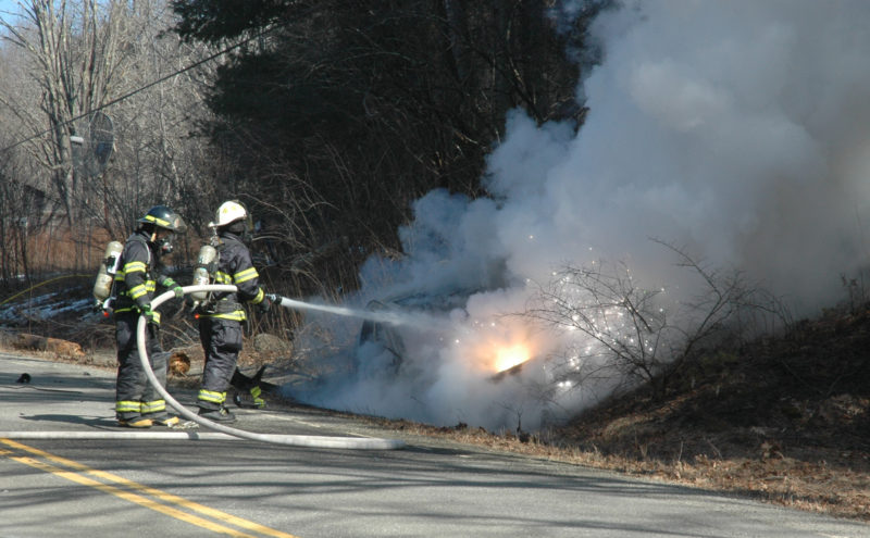 Firefighters battle a car fire on South Clary Road in Jefferson on Sunday, March 12. (Alexander Violo photo)