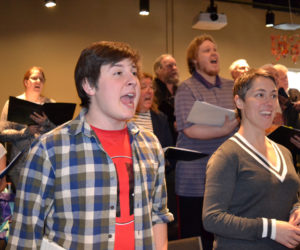 Foreground from left: Roosevelt Bishop, who plays Bert in Lincoln County Community Theater's upcoming production of "Mary Poppins," and Victoria Hamilton, who is in the title role, sing at a run-through of the musical on Sunday, March 12. (Christine LaPado-Breglia photo)