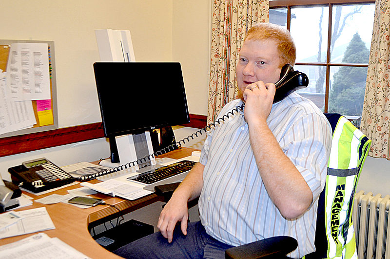 Lincoln County Emergency Management Agency Director Casey Stevens takes a call in his new office at the Lincoln County Courthouse. The agency's relocation is one of several changes in progress at the courthouse. (Charlotte Boynton photo)
